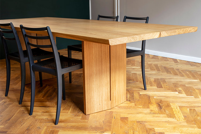 Moku Ita dining table paired with Elegance chairs from the BM1837 collection in a warm, Scandinavian dining setting.