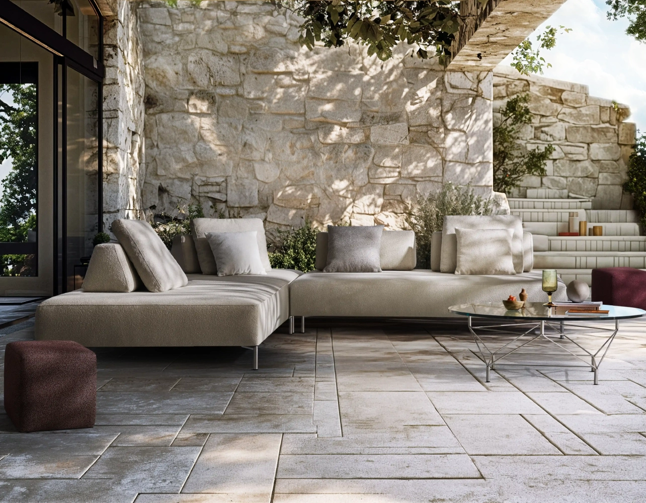 Eilersen Playtower outdoor modular sofa in mixed Lisbon fabrics, styled as an inviting patio seating area with soft cushions and minimalist metal base.