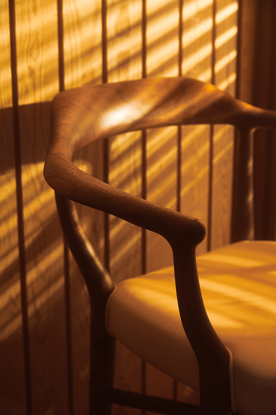 House of Finn Juhl 44 Chair in walnut with natural vegetable-tanned leather seat.