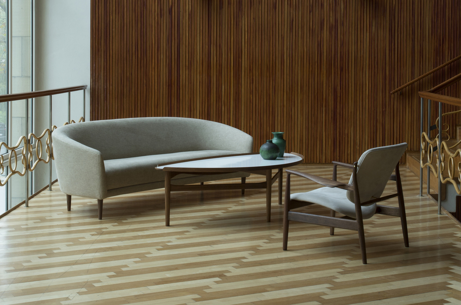 House of Finn Juhl Little Mother three-seater sofa in clay-coloured upholstery with walnut legs.
